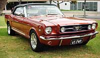 Front view 1965 Bronze convertible Mustang GT with the top up